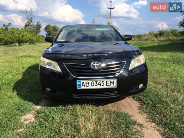 Черный Тойота Камри, объемом двигателя 2.36 л и пробегом 215 тыс. км за 11500 $, фото 1 на Automoto.ua