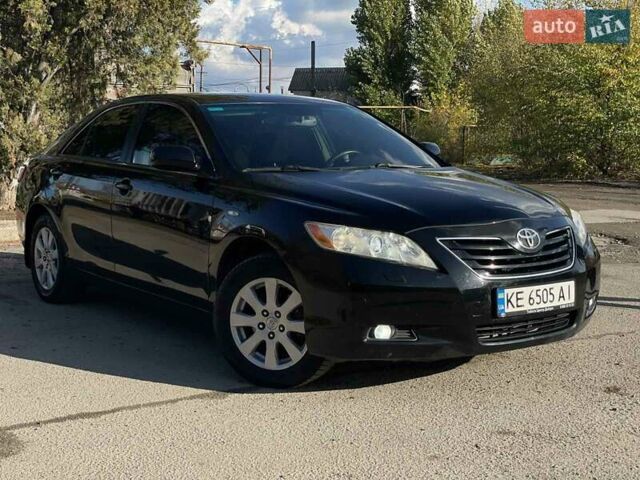 Черный Тойота Камри, объемом двигателя 2.4 л и пробегом 244 тыс. км за 8700 $, фото 1 на Automoto.ua