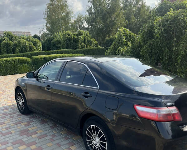 Черный Тойота Камри, объемом двигателя 2.36 л и пробегом 260 тыс. км за 7800 $, фото 1 на Automoto.ua