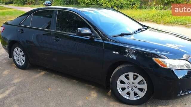 Черный Тойота Камри, объемом двигателя 2.4 л и пробегом 129 тыс. км за 10300 $, фото 1 на Automoto.ua