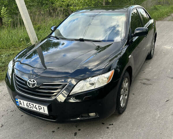 Черный Тойота Камри, объемом двигателя 2.4 л и пробегом 306 тыс. км за 8000 $, фото 1 на Automoto.ua