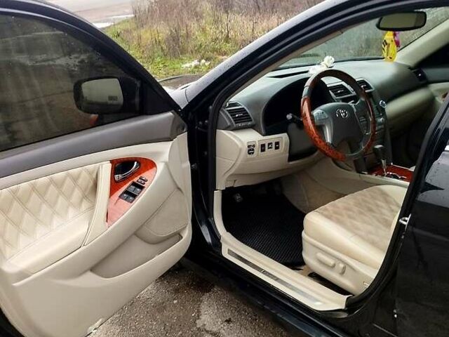 Черный Тойота Камри, объемом двигателя 2.4 л и пробегом 290 тыс. км за 9000 $, фото 1 на Automoto.ua