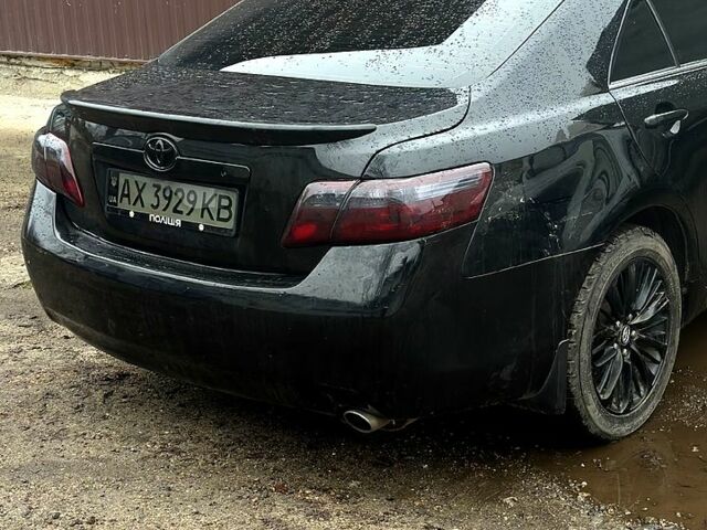 Черный Тойота Камри, объемом двигателя 2.4 л и пробегом 330 тыс. км за 8500 $, фото 1 на Automoto.ua