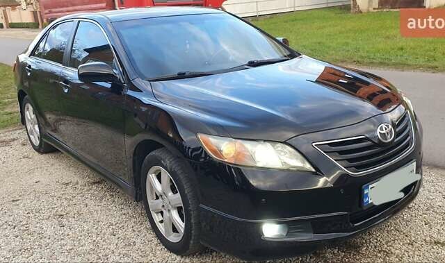 Черный Тойота Камри, объемом двигателя 2.4 л и пробегом 173 тыс. км за 7999 $, фото 1 на Automoto.ua