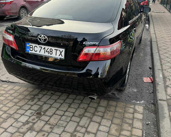 Чорний Тойота Камрі, об'ємом двигуна 2.4 л та пробігом 302 тис. км за 8400 $, фото 1 на Automoto.ua