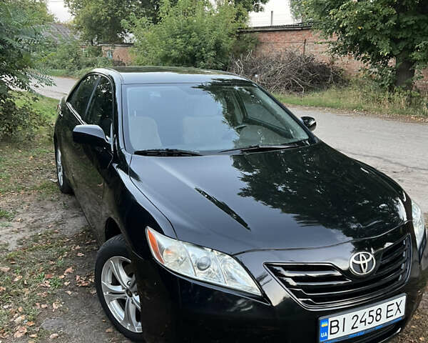 Чорний Тойота Камрі, об'ємом двигуна 2.36 л та пробігом 195 тис. км за 7850 $, фото 1 на Automoto.ua