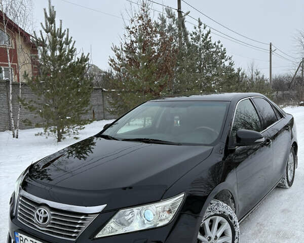 Черный Тойота Камри, объемом двигателя 2.49 л и пробегом 236 тыс. км за 12700 $, фото 1 на Automoto.ua