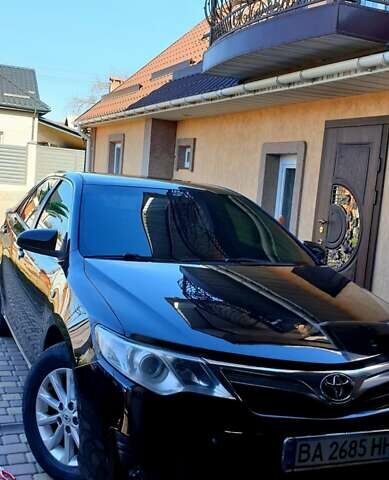 Черный Тойота Камри, объемом двигателя 2.5 л и пробегом 154 тыс. км за 9490 $, фото 1 на Automoto.ua