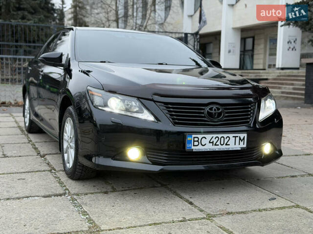 Черный Тойота Камри, объемом двигателя 2.5 л и пробегом 280 тыс. км за 9900 $, фото 1 на Automoto.ua