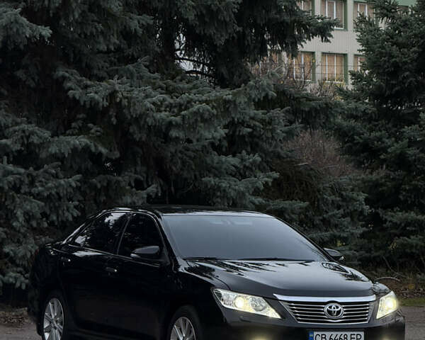 Чорний Тойота Камрі, об'ємом двигуна 2.49 л та пробігом 215 тис. км за 14500 $, фото 1 на Automoto.ua
