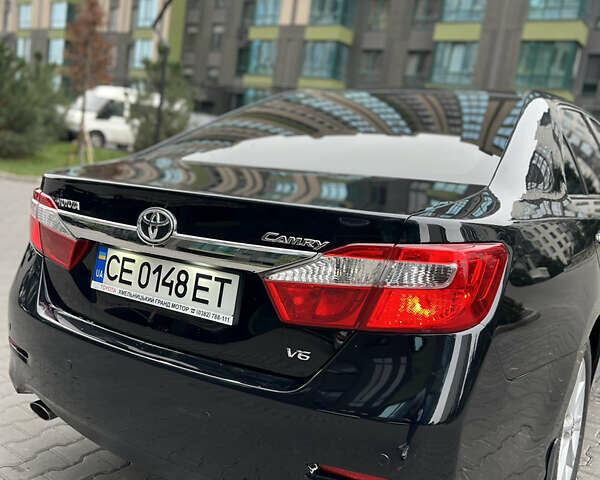 Черный Тойота Камри, объемом двигателя 3.46 л и пробегом 217 тыс. км за 13500 $, фото 1 на Automoto.ua