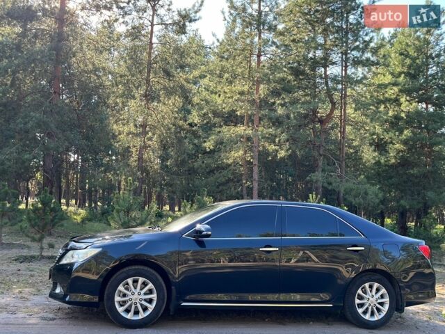 Чорний Тойота Камрі, об'ємом двигуна 2.5 л та пробігом 230 тис. км за 12990 $, фото 1 на Automoto.ua