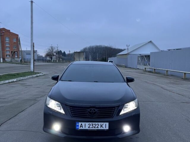 Черный Тойота Камри, объемом двигателя 2.5 л и пробегом 203 тыс. км за 13500 $, фото 1 на Automoto.ua