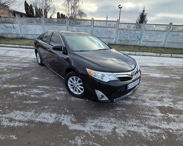 Черный Тойота Камри, объемом двигателя 2.49 л и пробегом 220 тыс. км за 9500 $, фото 1 на Automoto.ua