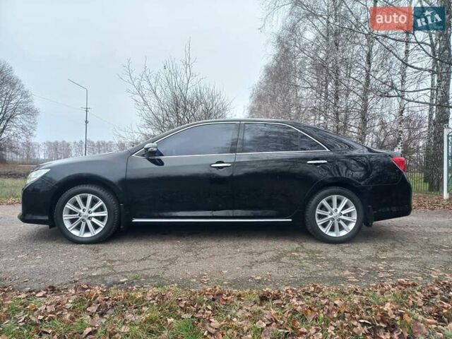 Чорний Тойота Камрі, об'ємом двигуна 2.5 л та пробігом 130 тис. км за 15900 $, фото 1 на Automoto.ua