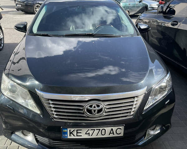 Черный Тойота Камри, объемом двигателя 2.5 л и пробегом 280 тыс. км за 11600 $, фото 1 на Automoto.ua