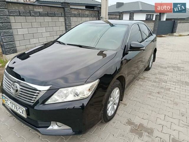 Чорний Тойота Камрі, об'ємом двигуна 2.5 л та пробігом 176 тис. км за 13499 $, фото 1 на Automoto.ua