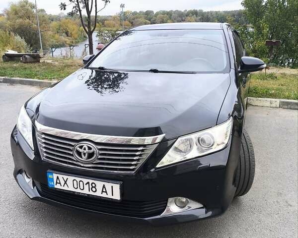Черный Тойота Камри, объемом двигателя 2.5 л и пробегом 205 тыс. км за 14300 $, фото 1 на Automoto.ua