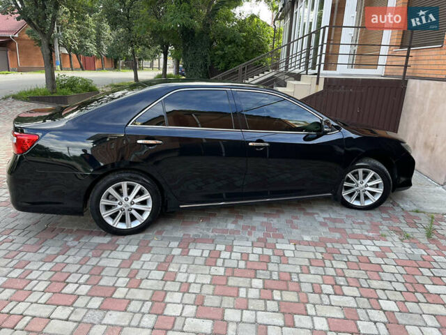 Черный Тойота Камри, объемом двигателя 3.5 л и пробегом 255 тыс. км за 14300 $, фото 1 на Automoto.ua
