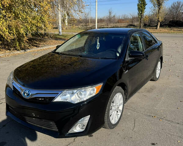 Черный Тойота Камри, объемом двигателя 2.49 л и пробегом 215 тыс. км за 13800 $, фото 1 на Automoto.ua