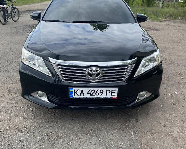 Чорний Тойота Камрі, об'ємом двигуна 2.5 л та пробігом 197 тис. км за 14750 $, фото 1 на Automoto.ua