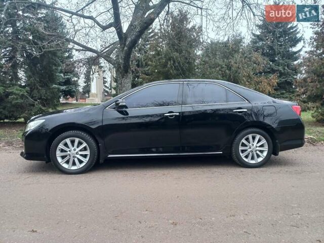Черный Тойота Камри, объемом двигателя 2.5 л и пробегом 127 тыс. км за 15700 $, фото 1 на Automoto.ua
