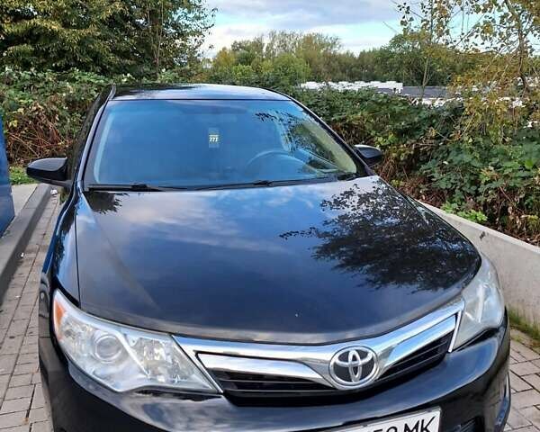 Черный Тойота Камри, объемом двигателя 2.5 л и пробегом 280 тыс. км за 12000 $, фото 1 на Automoto.ua