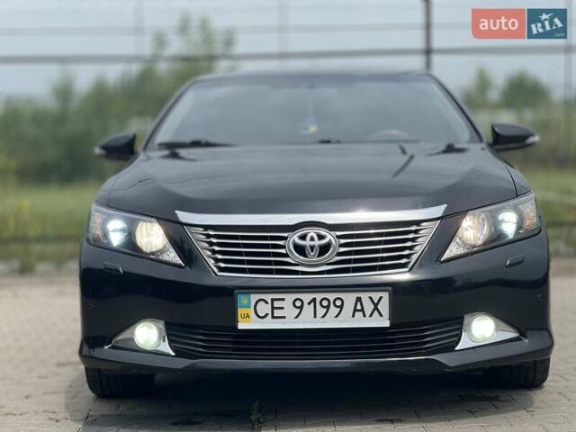 Черный Тойота Камри, объемом двигателя 2.5 л и пробегом 212 тыс. км за 12500 $, фото 1 на Automoto.ua