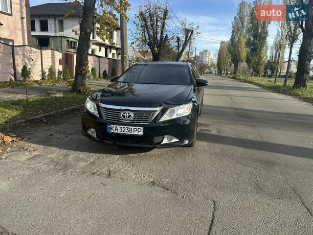 Черный Тойота Камри, объемом двигателя 2.49 л и пробегом 165 тыс. км за 12700 $, фото 1 на Automoto.ua