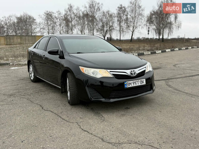 Черный Тойота Камри, объемом двигателя 2.5 л и пробегом 186 тыс. км за 12600 $, фото 1 на Automoto.ua