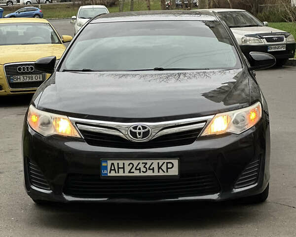 Черный Тойота Камри, объемом двигателя 2.49 л и пробегом 142 тыс. км за 11500 $, фото 1 на Automoto.ua