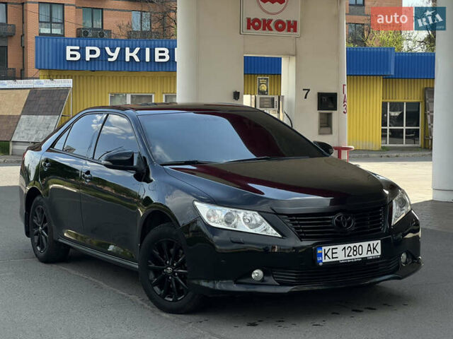 Черный Тойота Камри, объемом двигателя 2.49 л и пробегом 195 тыс. км за 12700 $, фото 1 на Automoto.ua