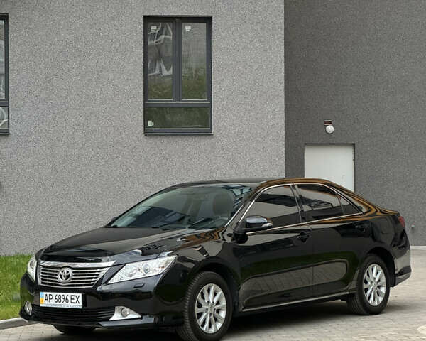 Черный Тойота Камри, объемом двигателя 2.5 л и пробегом 142 тыс. км за 13400 $, фото 1 на Automoto.ua