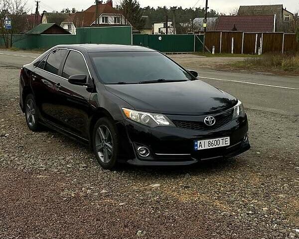 Черный Тойота Камри, объемом двигателя 2.5 л и пробегом 252 тыс. км за 10500 $, фото 1 на Automoto.ua