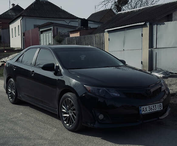 Чорний Тойота Камрі, об'ємом двигуна 2.49 л та пробігом 245 тис. км за 12200 $, фото 1 на Automoto.ua