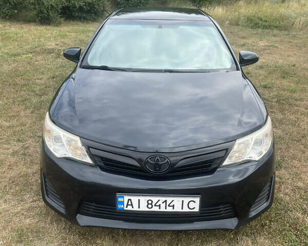 Черный Тойота Камри, объемом двигателя 2.5 л и пробегом 250 тыс. км за 10600 $, фото 1 на Automoto.ua