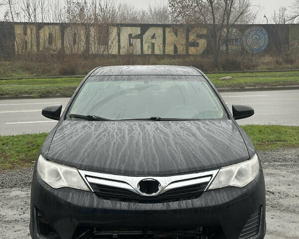 Черный Тойота Камри, объемом двигателя 2.49 л и пробегом 220 тыс. км за 7599 $, фото 1 на Automoto.ua