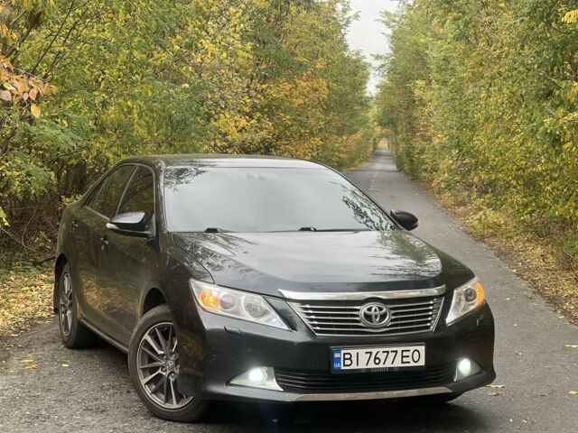 Черный Тойота Камри, объемом двигателя 2.5 л и пробегом 280 тыс. км за 12100 $, фото 1 на Automoto.ua