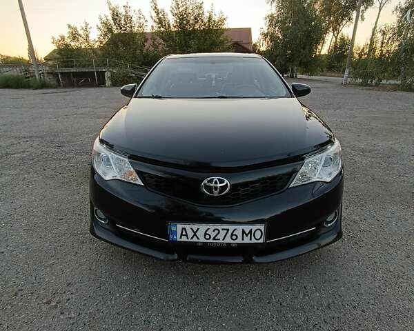 Черный Тойота Камри, объемом двигателя 2.49 л и пробегом 194 тыс. км за 12500 $, фото 1 на Automoto.ua