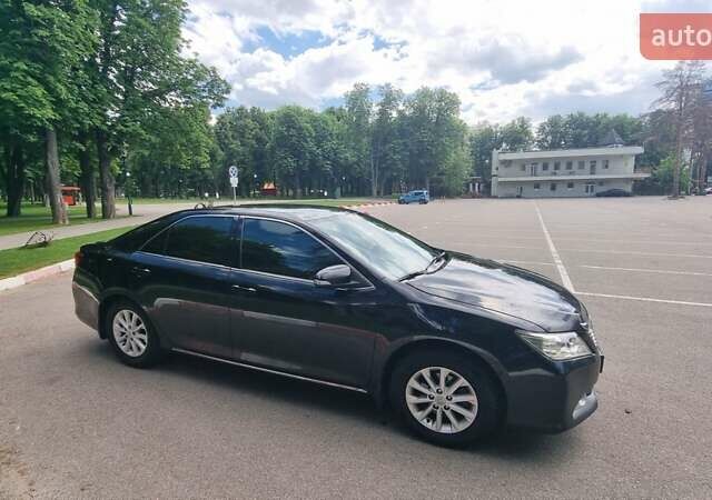 Черный Тойота Камри, объемом двигателя 2.5 л и пробегом 212 тыс. км за 12500 $, фото 1 на Automoto.ua