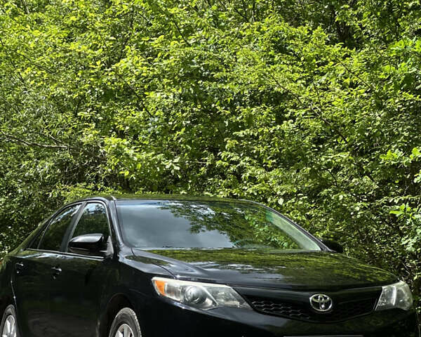 Черный Тойота Камри, объемом двигателя 2.5 л и пробегом 156 тыс. км за 11800 $, фото 1 на Automoto.ua