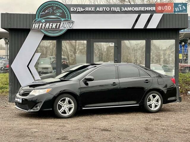 Черный Тойота Камри, объемом двигателя 2.49 л и пробегом 159 тыс. км за 13700 $, фото 1 на Automoto.ua