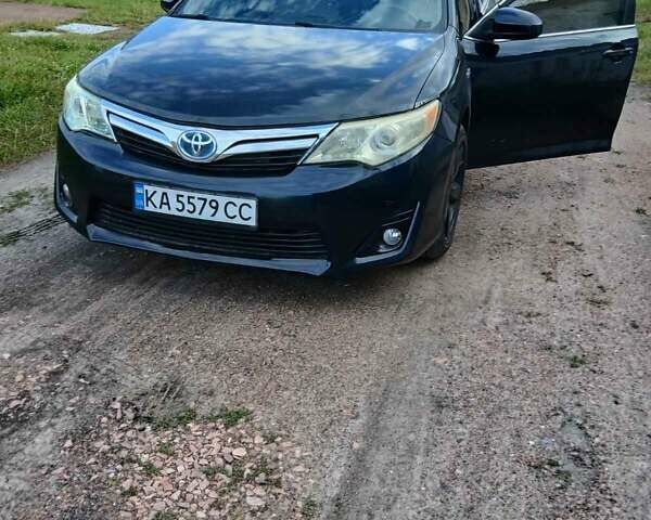 Черный Тойота Камри, объемом двигателя 2.5 л и пробегом 211 тыс. км за 12000 $, фото 1 на Automoto.ua