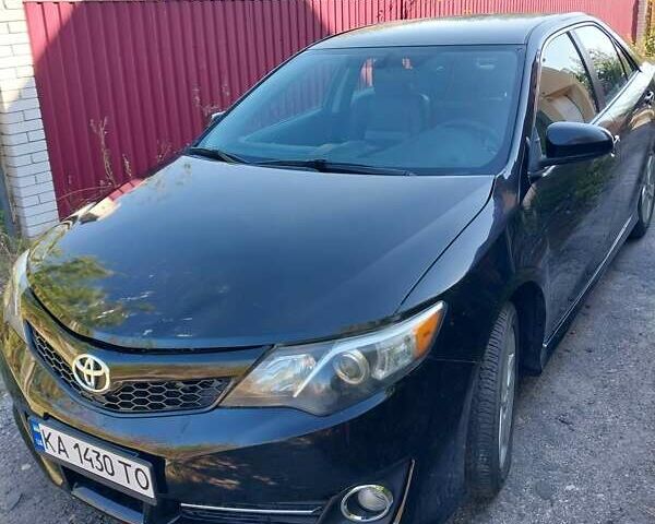 Черный Тойота Камри, объемом двигателя 2.5 л и пробегом 130 тыс. км за 12100 $, фото 1 на Automoto.ua