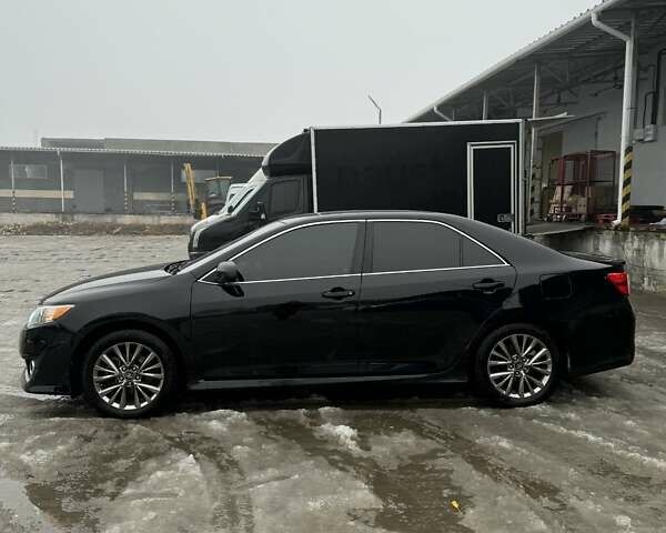 Черный Тойота Камри, объемом двигателя 2.49 л и пробегом 160 тыс. км за 13000 $, фото 1 на Automoto.ua