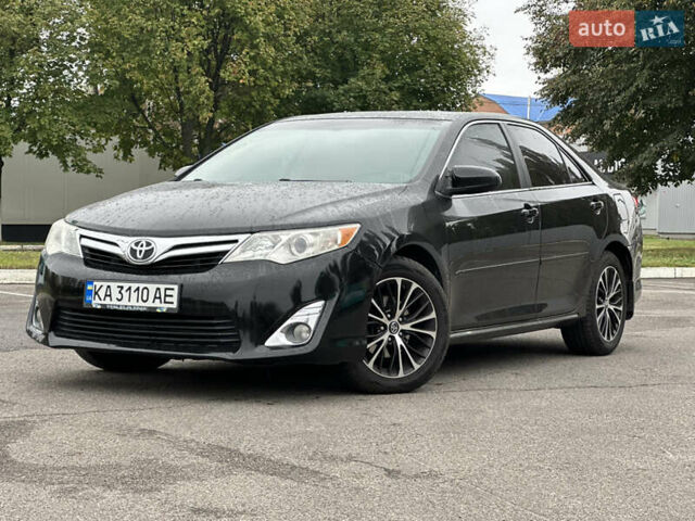 Черный Тойота Камри, объемом двигателя 2.49 л и пробегом 220 тыс. км за 10900 $, фото 1 на Automoto.ua