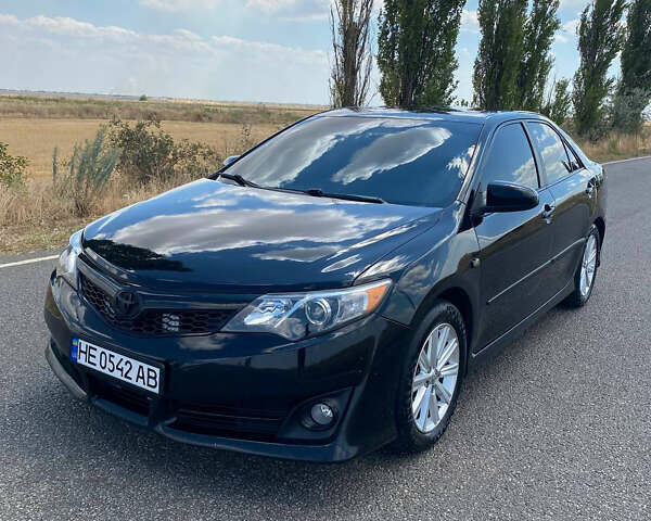 Чорний Тойота Камрі, об'ємом двигуна 2.49 л та пробігом 190 тис. км за 12250 $, фото 1 на Automoto.ua
