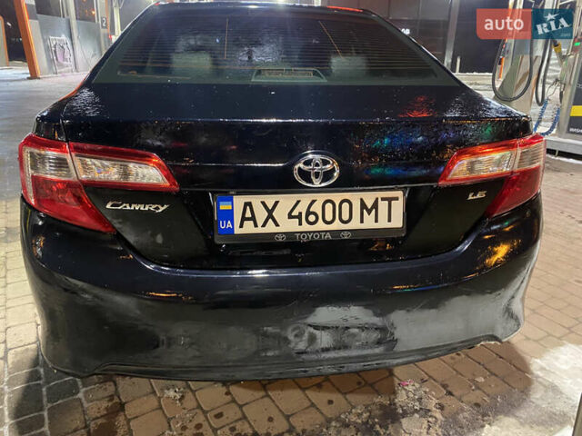 Черный Тойота Камри, объемом двигателя 2.49 л и пробегом 270 тыс. км за 9500 $, фото 1 на Automoto.ua