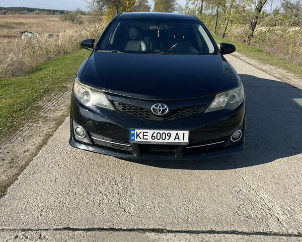 Черный Тойота Камри, объемом двигателя 2.49 л и пробегом 237 тыс. км за 12300 $, фото 1 на Automoto.ua