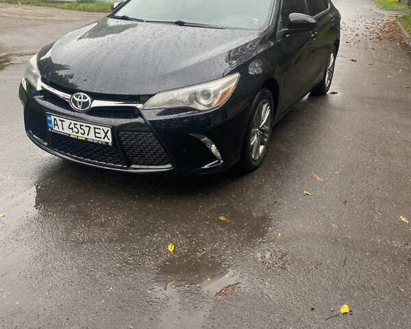 Черный Тойота Камри, объемом двигателя 2.5 л и пробегом 140 тыс. км за 15700 $, фото 1 на Automoto.ua